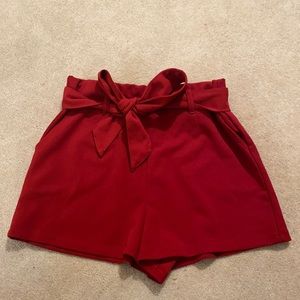 Red high waisted flow shorts with tie